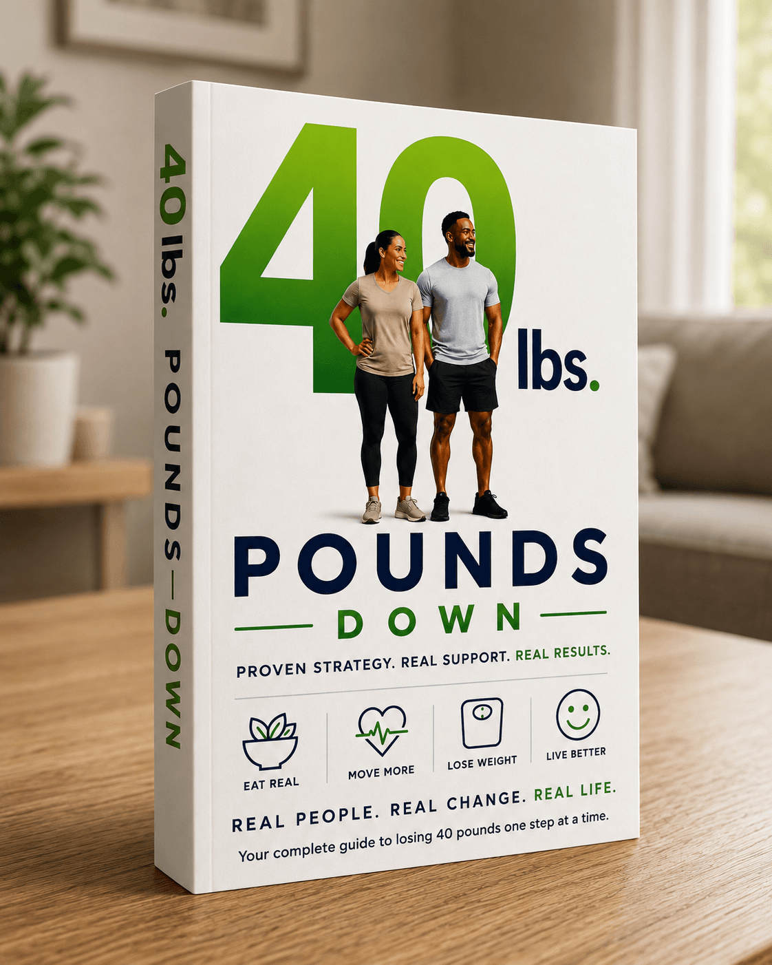 The 40 Pounds Down softcover book standing on a table. Its cover shows a large green 40 lbs. above two people standing together, over the words Pounds Down, and the spine reads 40 lbs. Pounds Down.